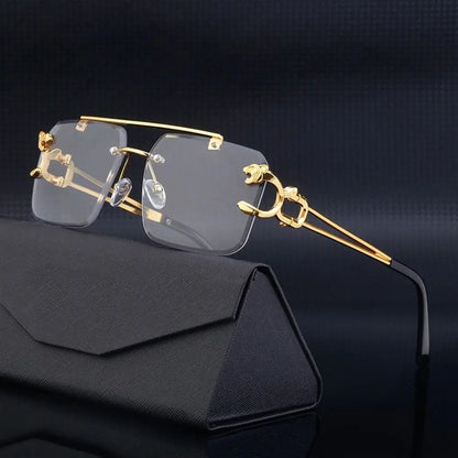 Gold-framed rimless glasses on a black background