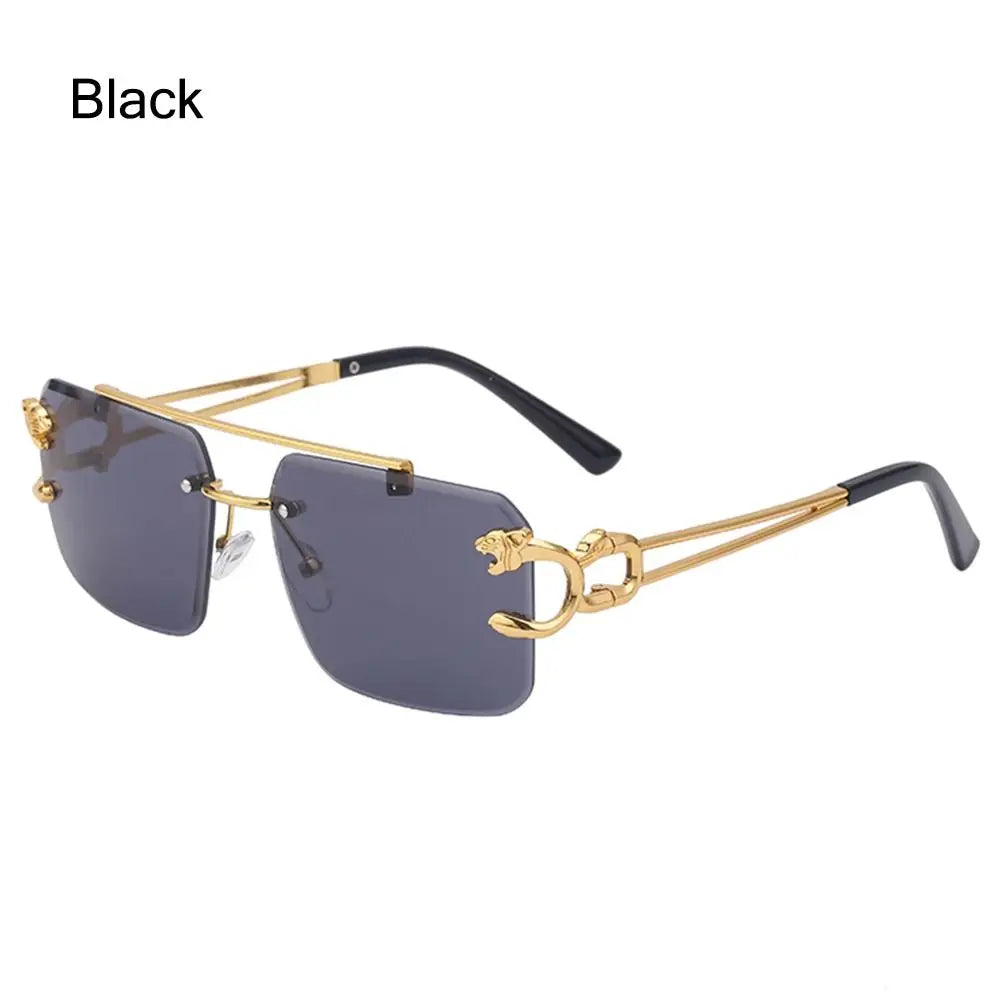 Gold-framed sunglasses with black arms on a white background