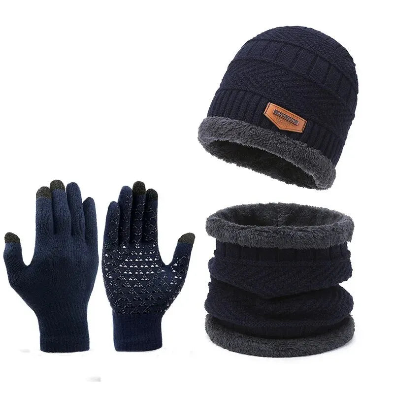 Navy blue winter hat, gloves, and neck warmer set on a white background