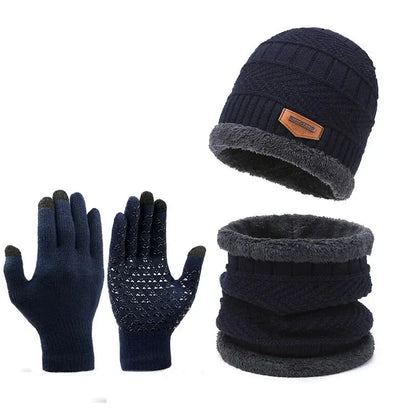 Navy blue winter hat, gloves, and neck warmer set on a white background