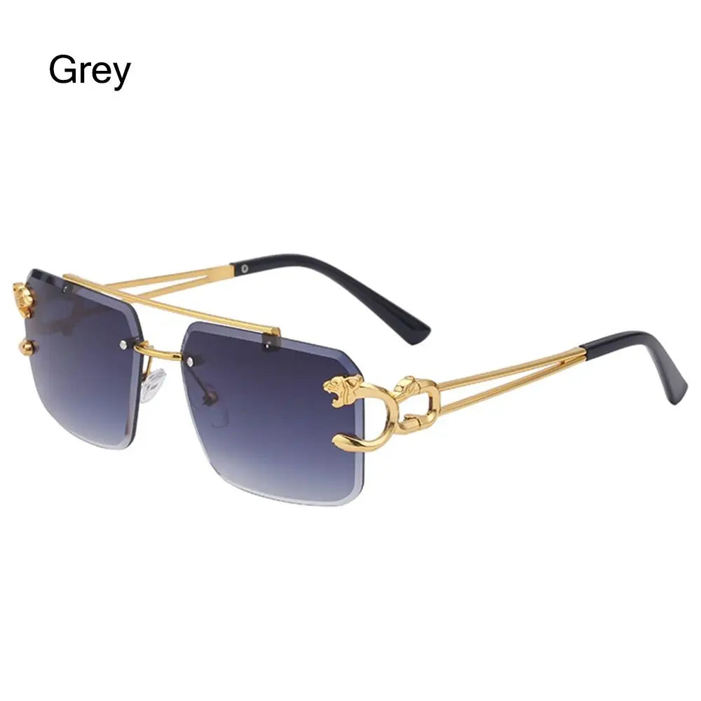 Gold-framed sunglasses with gradient lenses on a white background